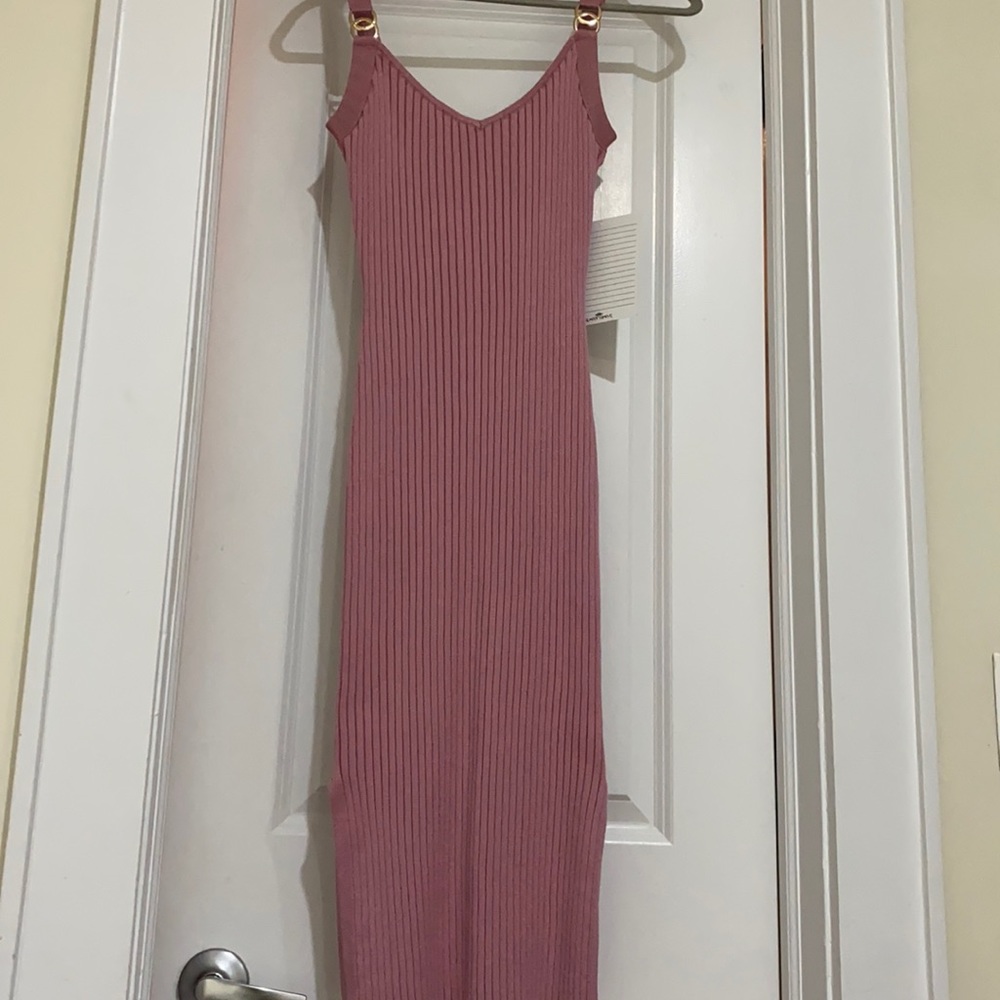 Pink, form fitting, midi dress with gold details. Size small.
